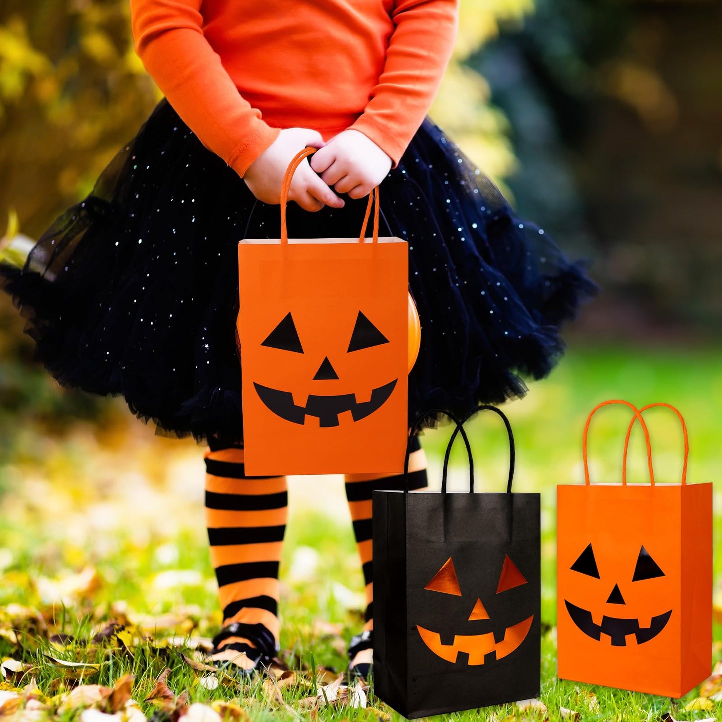 JarThenaAMCS 24Pcs Halloween Kraft Paper Bags with Handles Evil Pumpkin Gift Bags Orange Black Pumpkin Candy Goodie Bag for Birthday Trick or Treat Party Supplies