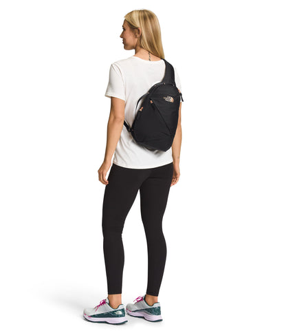 The North Face Women's Isabella Sling - Slim Carry Crossbody Bag with Large Main Compartment, Water-Repellent Finish, TNF Black Light Heather/Burnt Coral Metallic-NPF, One Size