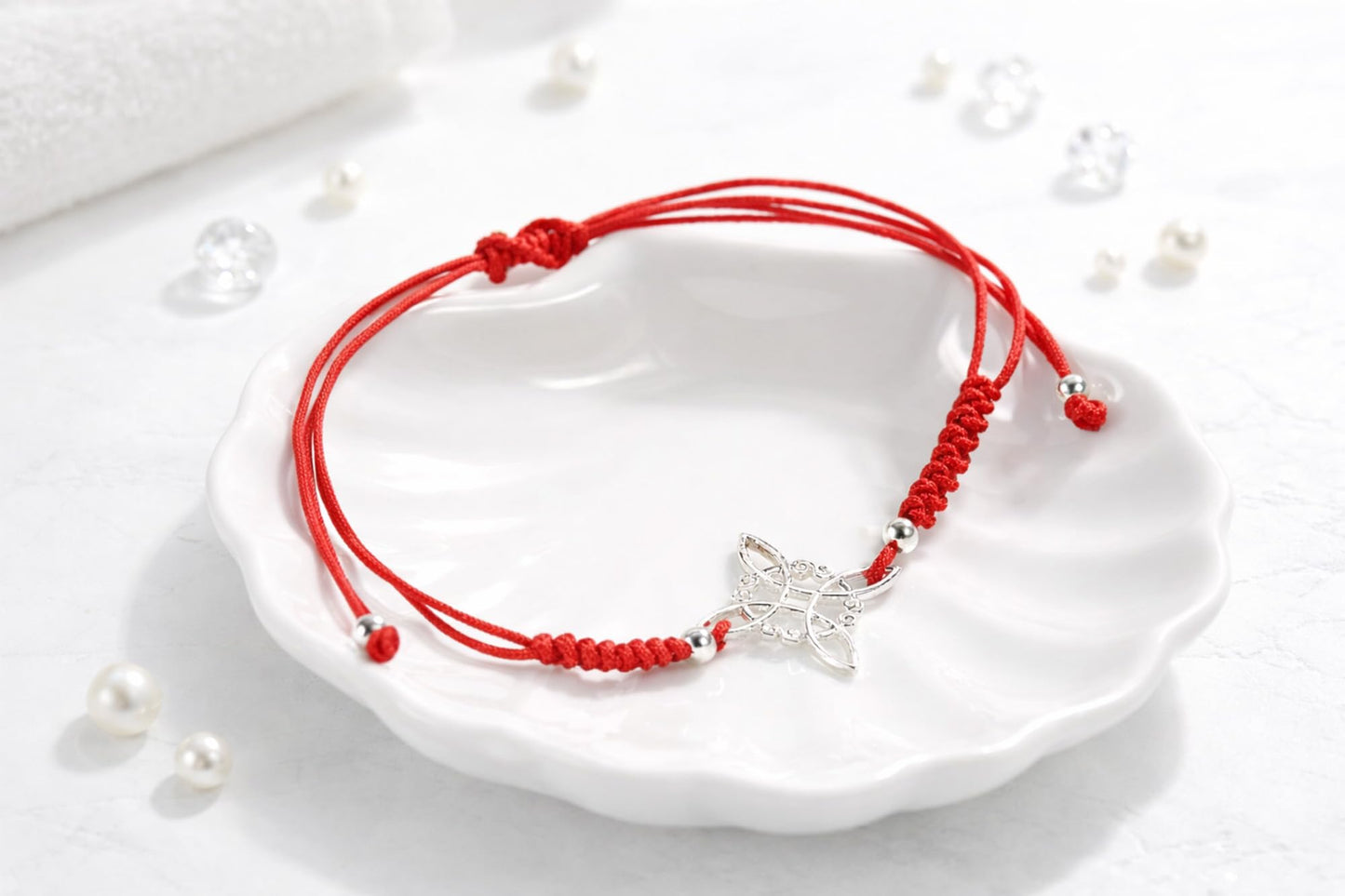 AeraVida Adjustable Red Witches Knot Bracelet with Sterling Silver Flower Charm – 19mm Symbol Centerpiece, Cotton Rope Band 6 to 9 Inches, Sliding Knot Closure