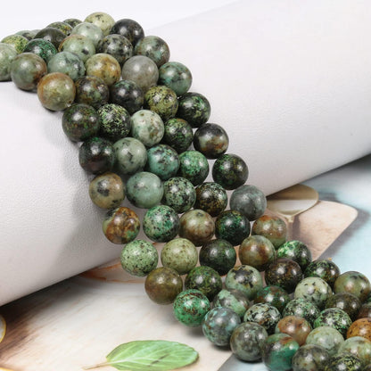 NITOPUPU 100Pcs 8mm Natural Smooth African Turquoise Gemstone Beads Round Loose Stone Beads for Jewerly Making with Crystal Stretch Cord