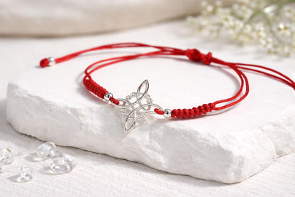AeraVida Adjustable Red Witches Knot Bracelet with Sterling Silver Flower Charm – 19mm Symbol Centerpiece, Cotton Rope Band 6 to 9 Inches, Sliding Knot Closure