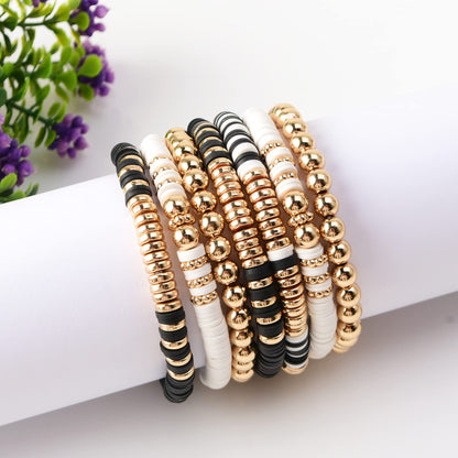 GOOJIDS Black Surfer Heishi Clay Bead Bracelets for Women Bohemian Stackable Gold Plated Beaded Stretch Bracelets Elastic Layering Friendship Bracelets Set Jewelry Gift