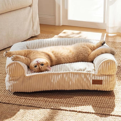 FUKUMARU Dog Couch Bed, Corduroy Cozy Cat Bed for Indoor Cats with Washable Cover, 28in Waterproof Orthopedic Dog Beds Sofa for Small Dogs and Large Cats, Cute Warm Cotton Pet Sofa, Cream