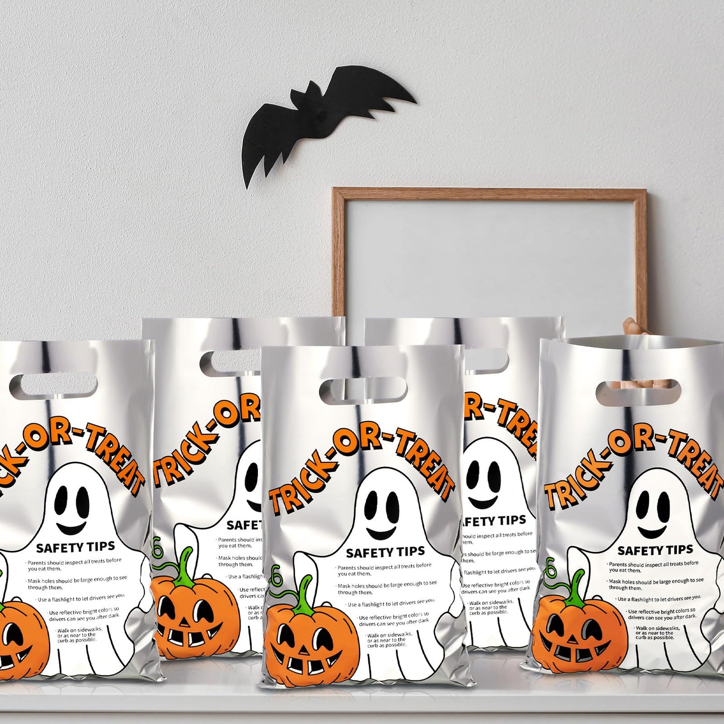 Hosuly 100 Pcs Trick or Treat Reflective Goodie Bags Bulk Halloween Plastic Gift Bags Safety Tips with Handles for Halloween Trick or Treat Themed Party Favors