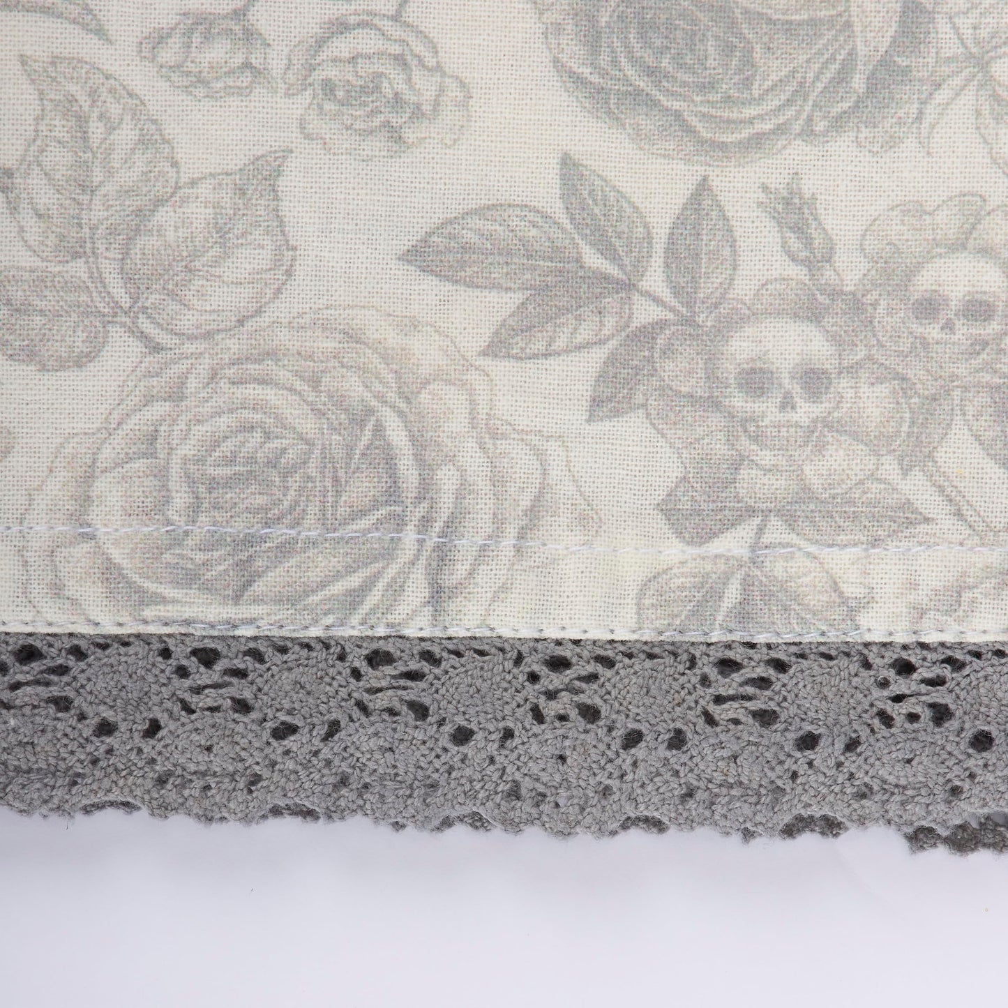 Primitives by Kathy Decorative Kitchen Towel, from Our Halloween Collection displays a Spooky Monochrome Pattern of Skull Flowers and Roses with a complementing Gray lace Trim