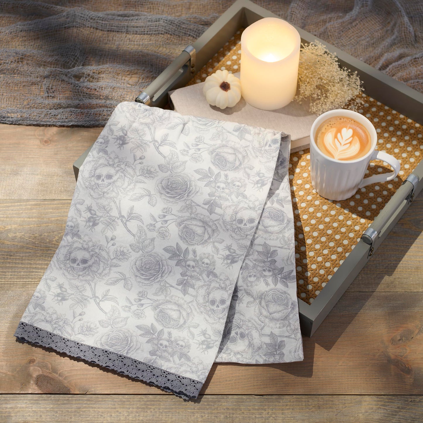Primitives by Kathy Decorative Kitchen Towel, from Our Halloween Collection displays a Spooky Monochrome Pattern of Skull Flowers and Roses with a complementing Gray lace Trim