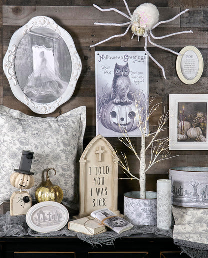 Primitives by Kathy Decorative Kitchen Towel, from Our Halloween Collection displays a Spooky Monochrome Pattern of Skull Flowers and Roses with a complementing Gray lace Trim