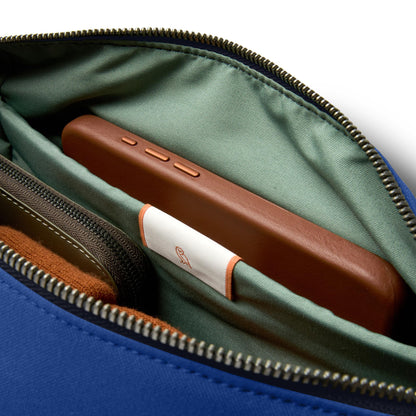 Bellroy Classic Sling (everyday 7 liter minimalist crossbody bag with internal organization, adjustable strap, and auto-compression system) - Indigo